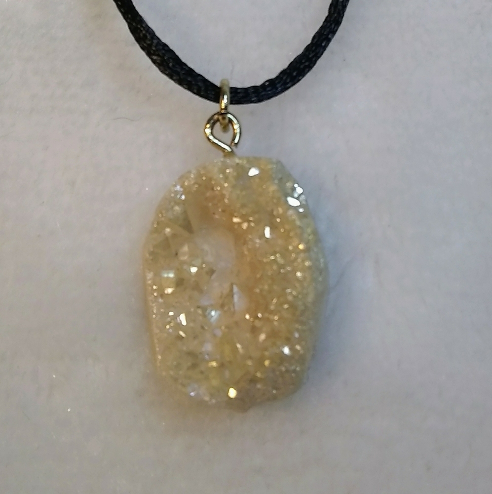 Crystal pendent on a silk cord